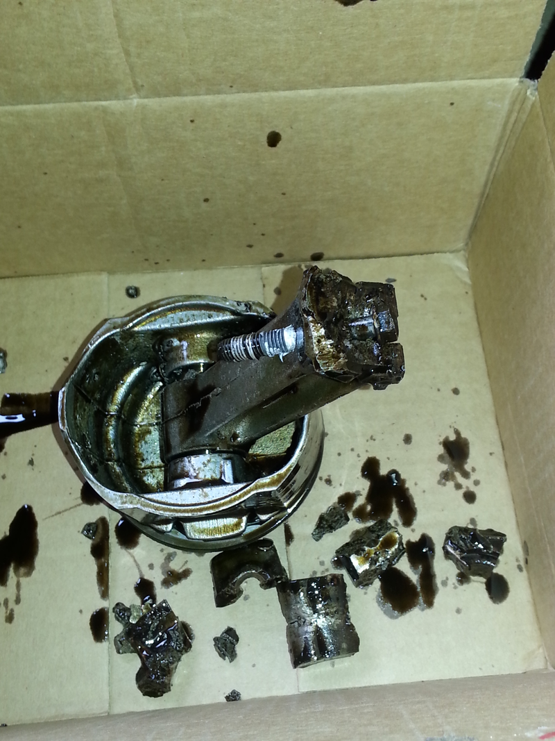 Illustration for article titled The bits and pieces of my broken mower engine.